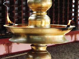 Closeup of lighted traditional Indian oil lamp photo