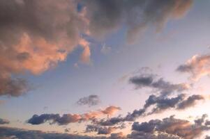 Sun Setting Over Clouds in Sky photo