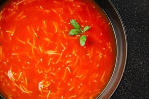 Tomato soup with vermicelli dish fresh gourmet food background on the table rustic food top view copy space photo