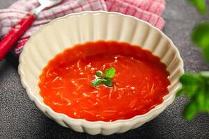 Tomato soup with vermicelli dish fresh gourmet food background on the table rustic food top view copy space photo