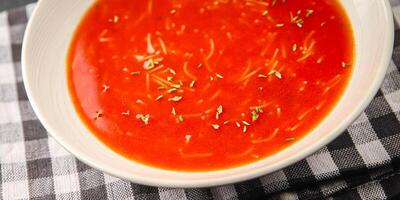 Tomato soup with vermicelli dish fresh gourmet food background on the table rustic food top view copy space photo