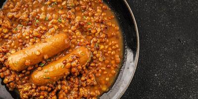 Lentil with sausage tasty food dish second course fresh gourmet food background on the table rustic food top view copy space top view photo
