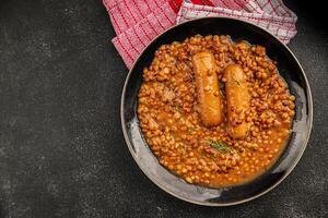 Lentil with sausage tasty food dish second course fresh gourmet food background on the table rustic food top view copy space top view photo
