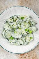 cucumber salad fresh cream tasty food dish fresh delicious gourmet background on the table rustic food top view copy space top view keto and paleo diet Vegetarian and vegan food photo