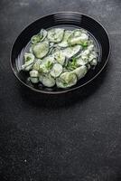 cucumber salad fresh cream tasty food dish fresh delicious gourmet background on the table rustic food top view copy space top view keto and paleo diet Vegetarian and vegan food photo