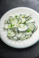 cucumber salad fresh cream tasty food dish fresh delicious gourmet background on the table rustic food top view copy space top view keto and paleo diet Vegetarian and vegan food photo