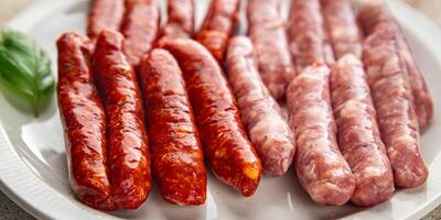 raw sausages beef, pork, chicken, lamb, dish fresh delicious gourmet food background on the table rustic food top view copy space photo