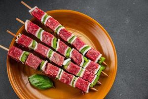 meat kebab raw vegetable, beef, lard, pepper dish fresh gourmet food background on the table rustic food top view copy space photo