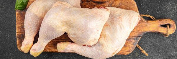 Chicken leg raw chicken meat fresh quarters tasty food dish delicious gourmet food background on the table rustic food top view copy space top view keto and paleo diet photo