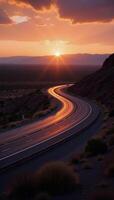 Stunning photograph of curved highway at sunset in the desert landscape photo
