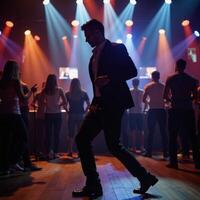 A man dancing at a nightclub photo