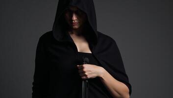 Mysterious hooded silent female rogue assassin photo
