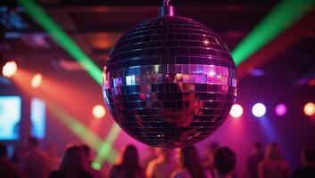 Vibrant discothemed nightclub with a large glowing mirror ball photo