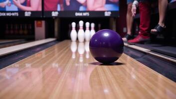 Cartoony image shows a bowling ball crushing pins in a bowling alley photo