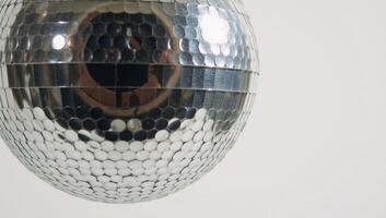 A simple line drawing showcasing a 70sstyle disco ball photo
