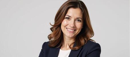A professional businesswoman exudes confidence with subtle makeup and stylishly wavy locks photo