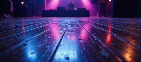 Neonlit empty rave dance floor at nighttime photo
