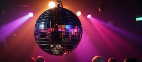 Vibrant discothemed nightclub with a large glowing mirror ball photo