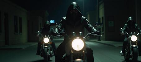 Three mysterious ominous hooded riders on motorcycles cruise through the night in a spinetingling thrilling scene photo