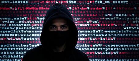 Hacker in hood against glitchy computer code backdrop Glitch Art Style photo