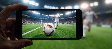 Smartphone screen displaying a 3Drendered image of a soccer ball during an online game or streaming event photo
