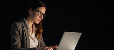 Businesswoman working on laptop photo