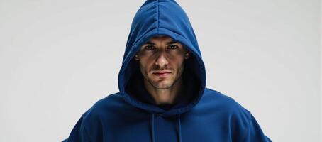 Image of a hooded hacker figure clad in a blue hoodie on a white backdrop photo