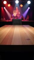 An empty wooden table stands amidst a blurred disco club backdrop for product demonstration photo