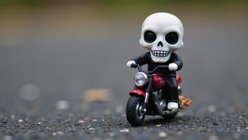 Small skullheaded humanoid figure on a flameadorned miniature motorbike photo