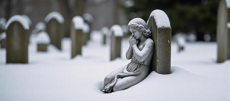 Wintery scene featuring snowcovered angel statue as a poignant representation of sorrow and reminiscence within a cemetery photo