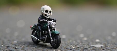 Small skullheaded humanoid figure on a flameadorned miniature motorbike photo