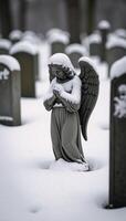 Wintery scene featuring snowcovered angel statue as a poignant representation of sorrow and reminiscence within a cemetery photo