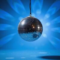 Vibrant blue backdrop with glittering disco ball for a lively party mood photo