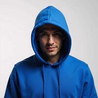 Image of a hooded hacker figure clad in a blue hoodie on a white backdrop photo