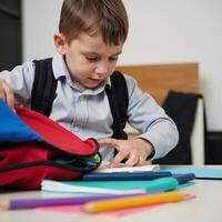 Little boy preparing for school using futuristic tech photo
