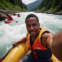 An African American man takes an exhilarating closeup selfie during whitewater river rafting while paddling a canoe or kayak in the extreme sport setting photo