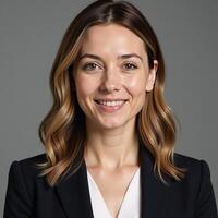 A confident businesswoman sporting natural makeup and flowing waves photo