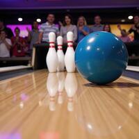 Cartoony image shows a bowling ball crushing pins in a bowling alley photo