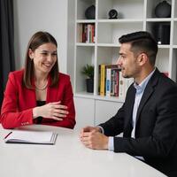 A redoutfitted financial advisor explains retirement fund diversification to a Gen Z entrepreneur photo