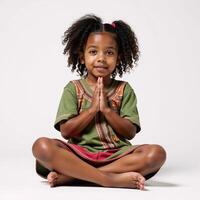 A simple 2D illustration depicts a young black girl praying in a plain setting photo