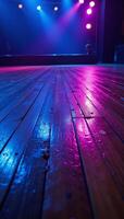 Neonlit empty rave dance floor at nighttime photo