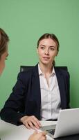 Mentorship conversation with employee seeking guidance employee manager on light green backdrop photo