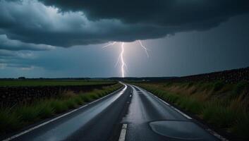 Stormtossed road with distant lightning and ominous clouds photo