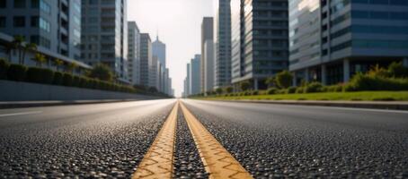 Empty cityscape view along an asphalt road surrounded by towering buildings and a bustling metropolis skyline photo