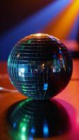 Shiny Disco Ball surrounded by kaleidoscopic light reflections photo