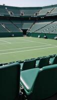 Image of vacant tennis courts with surrounding stadium seating photo
