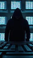 Hooded hacker silhouette amidst glowing binary codes and screens displaying number sequences photo