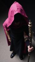 Pinkhooded figure shrouded in mystery photo