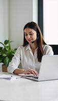 A dedicated technical support expert working efficiently in a streamlined office environment photo