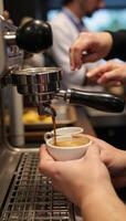 Barista preparing aromatic espresso at caf restaurant photo